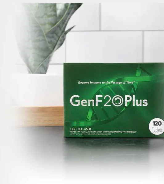The GenF20 Plus box standing on a light counter, white metro tiles and a potted plant behind it, the 120-count badge on its front corner